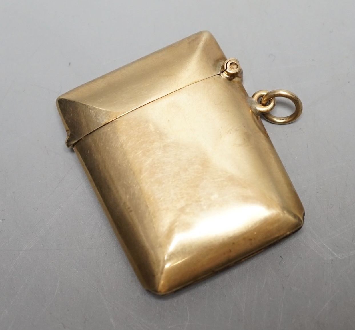 A George V 9ct gold vest case, with engraved monogram, William Neale Ltd, Chester, 1911, 46mm, gross weight 15.2 grams.